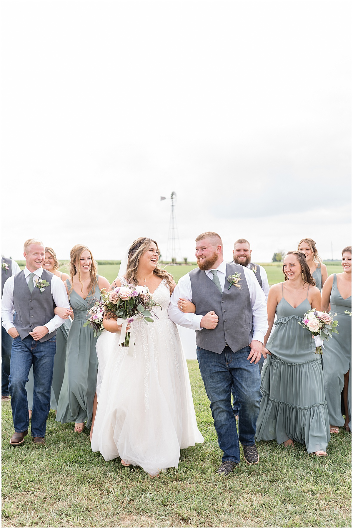 Couple walks with bridal party at private property wedding in Peru, Indiana