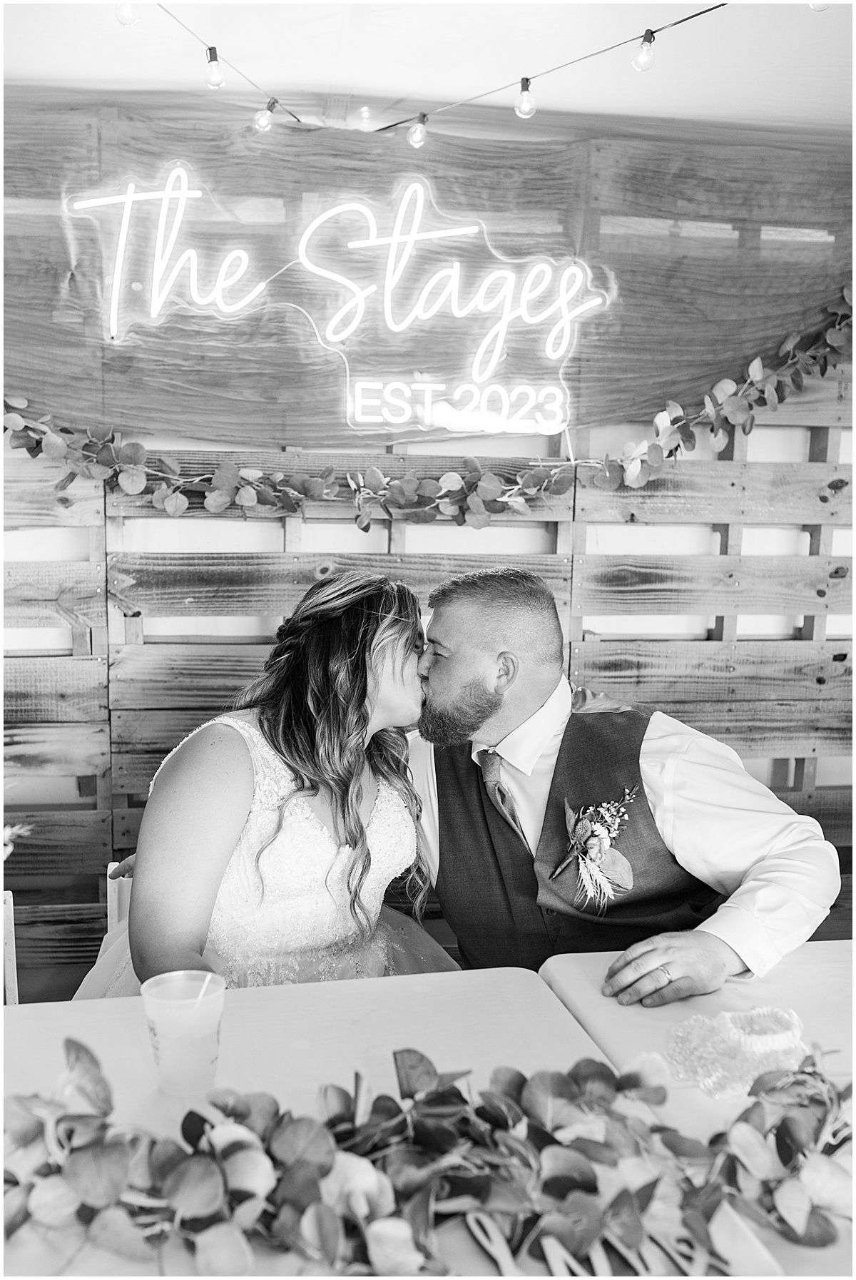 Newlyweds kiss at reception at private property wedding in Peru, Indiana