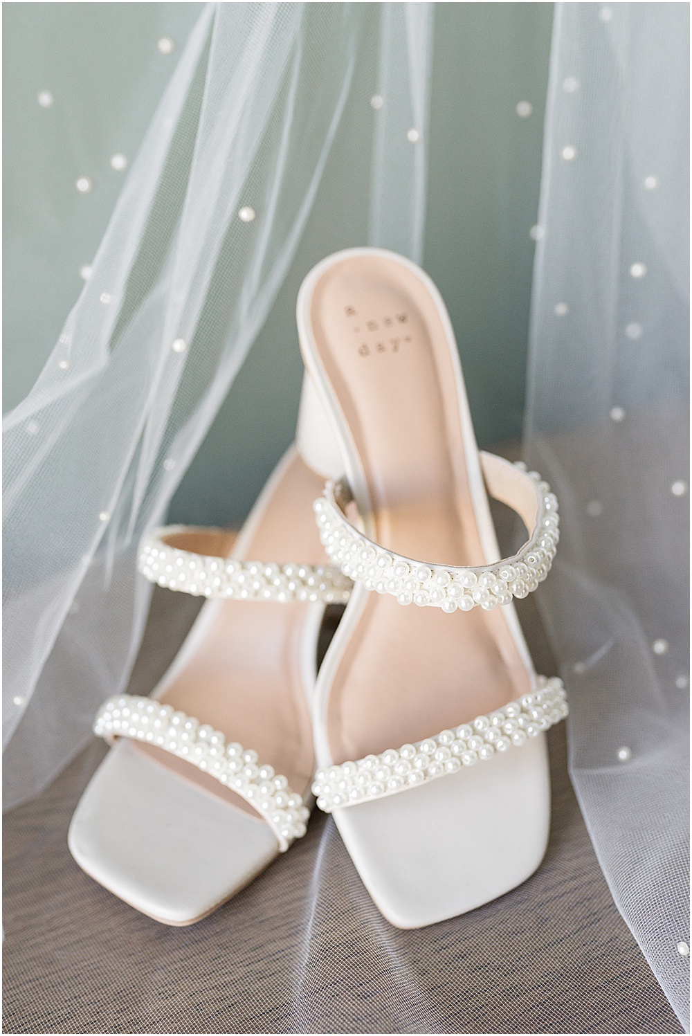 Bride's pearl-covered shoes for at-home, brunch wedding in Westfield, Indiana