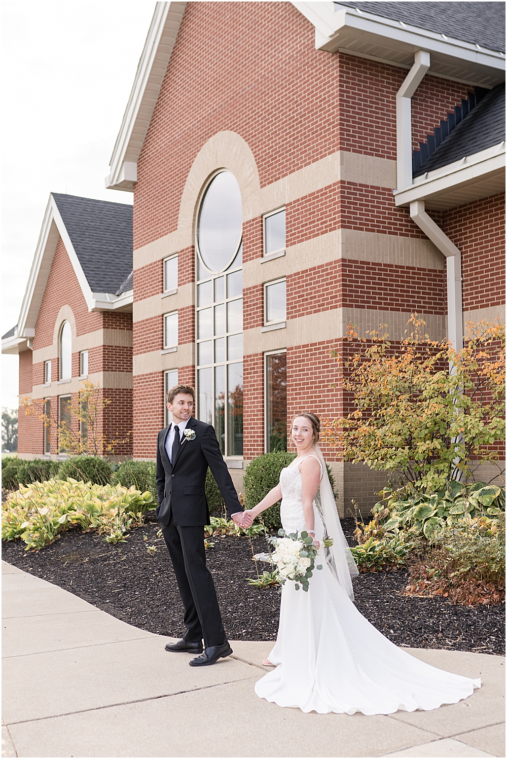 Bride and groom portraits at St. Maria Goretti Catholic Church in Westfield, Indiana