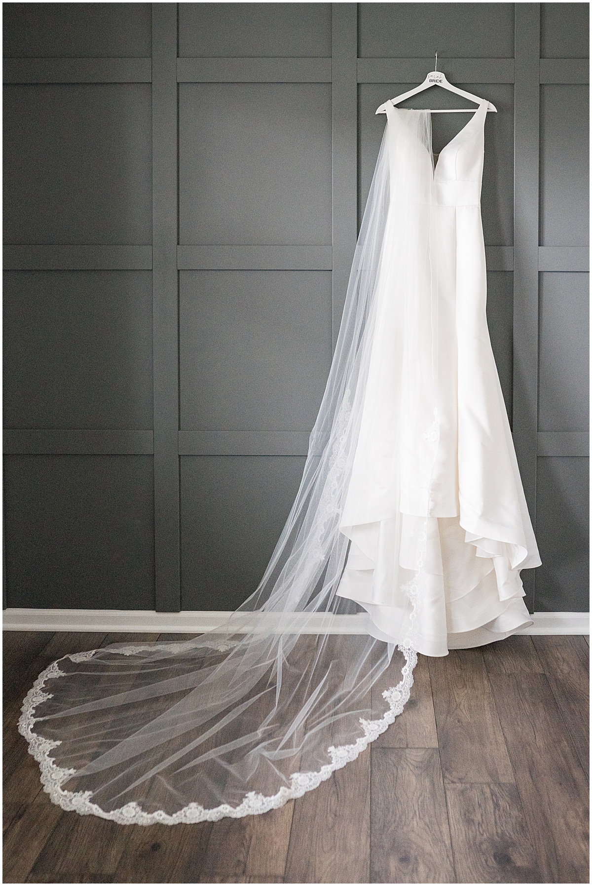 Dress hanging with lace veil for Lighthouse Restaurant wedding in Cedar Lake, Indiana