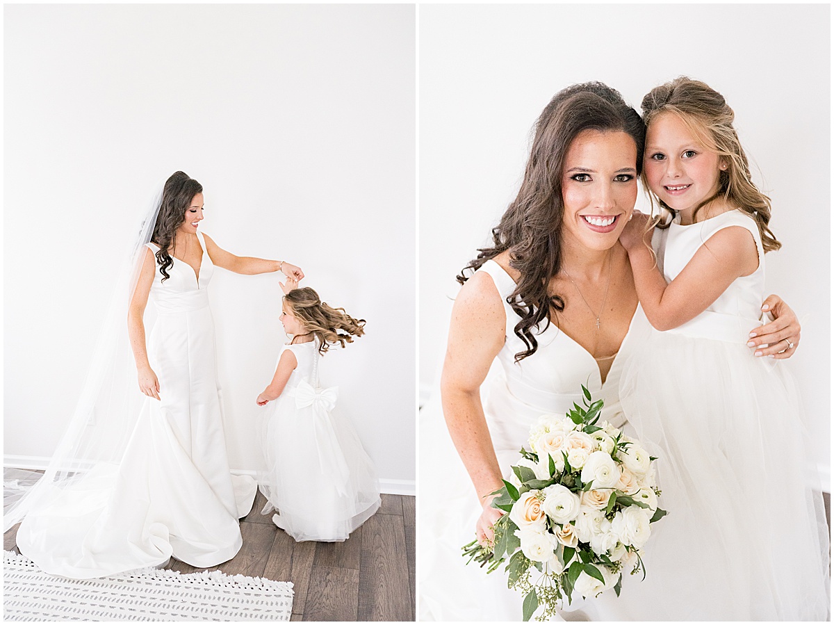 Bride with flower girl at Lighthouse Restaurant wedding in Cedar Lake, Indiana