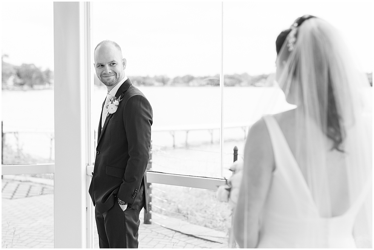 Groom reacts to bride before Lighthouse Restaurant wedding in Cedar Lake, Indiana
