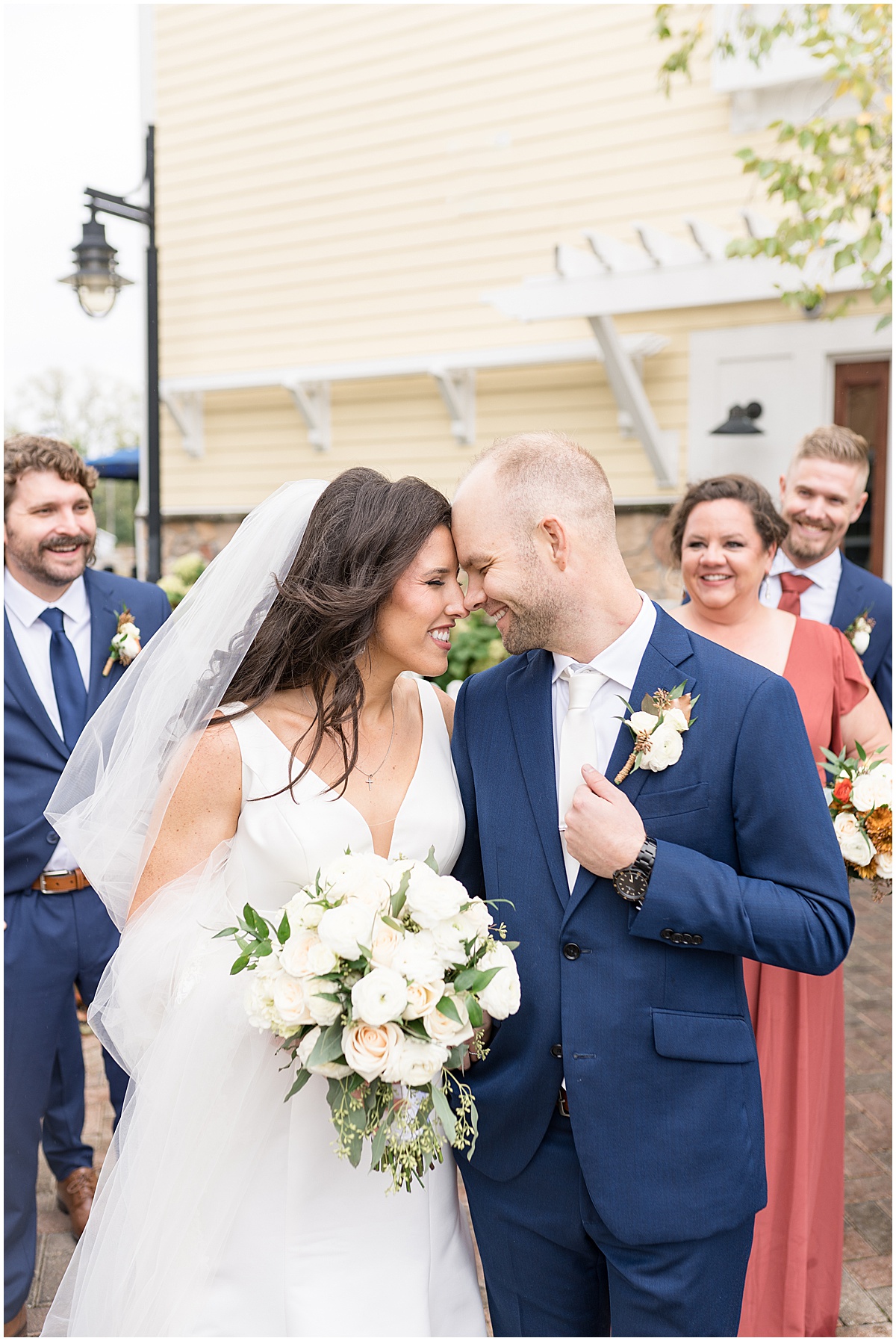 Bride and groom get close during outside photos at Lighthouse Restaurant wedding in Cedar Lake, Indiana