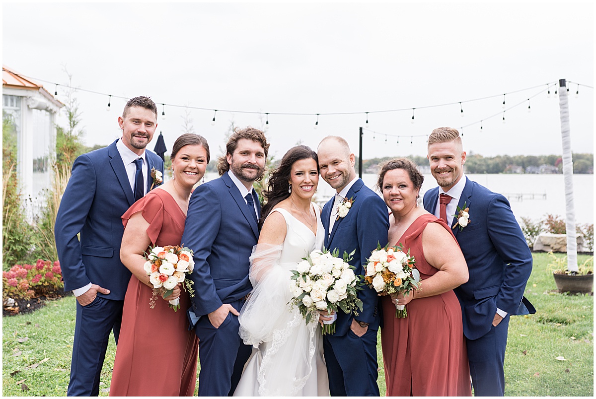 Orange and Navy bridal party at Lighthouse Restaurant wedding in Cedar Lake, Indiana
