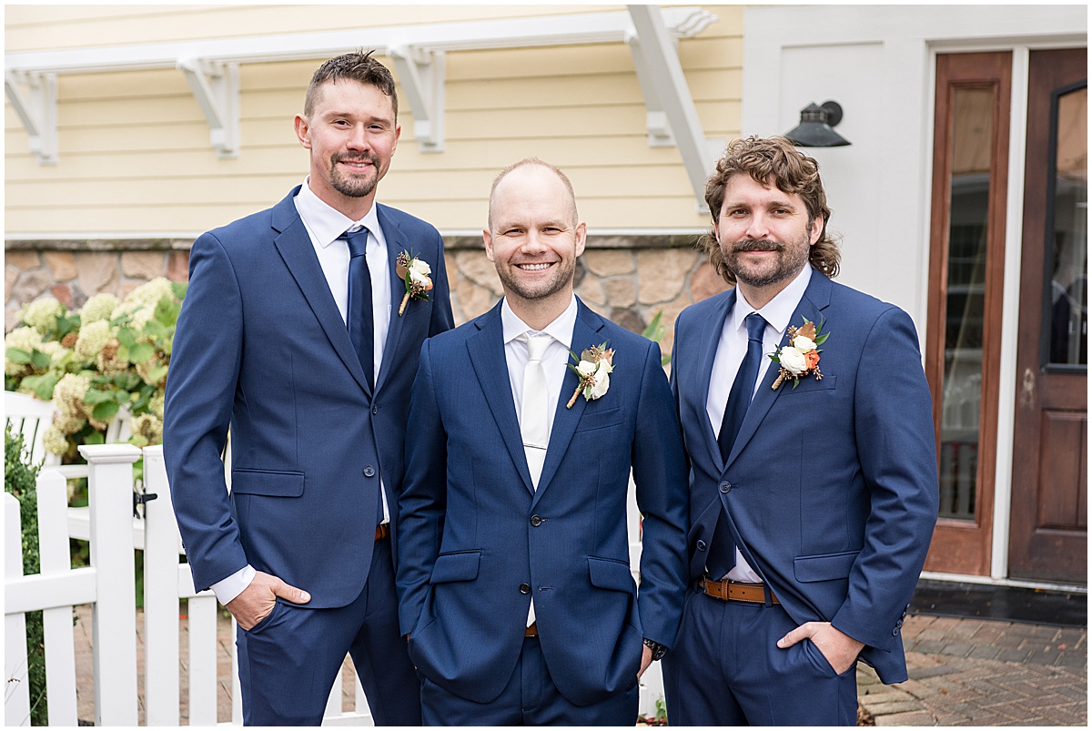 Groom with groomsmen in navy tux for Lighthouse Restaurant wedding in Cedar Lake, Indiana