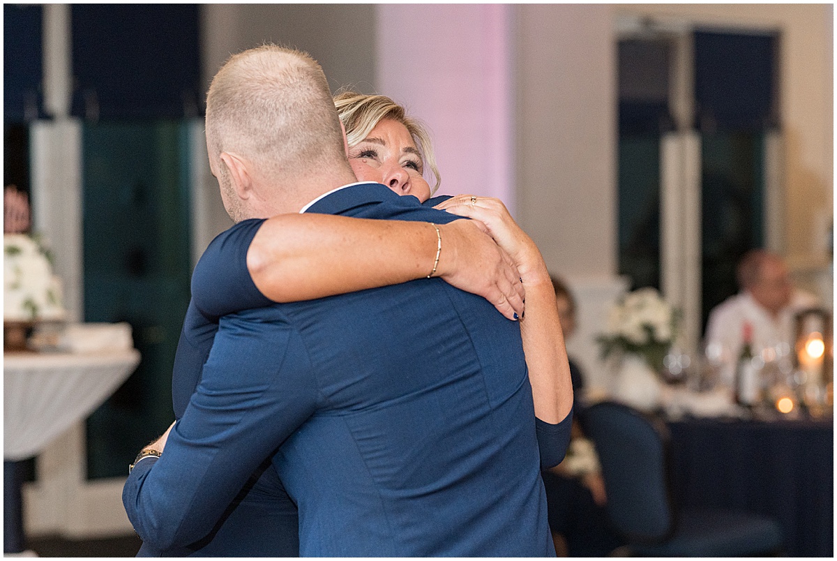 Mother of the groom hugs at Lighthouse Restaurant wedding in Cedar Lake, Indiana