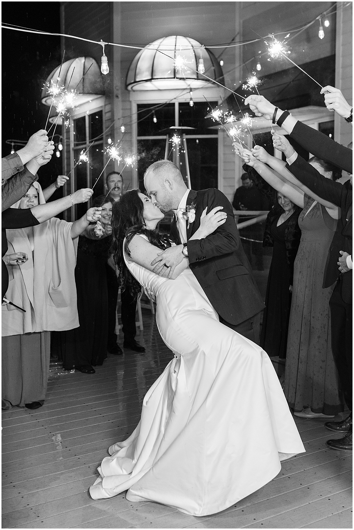 Sparkler exit kiss at Lighthouse Restaurant wedding in Cedar Lake, Indiana