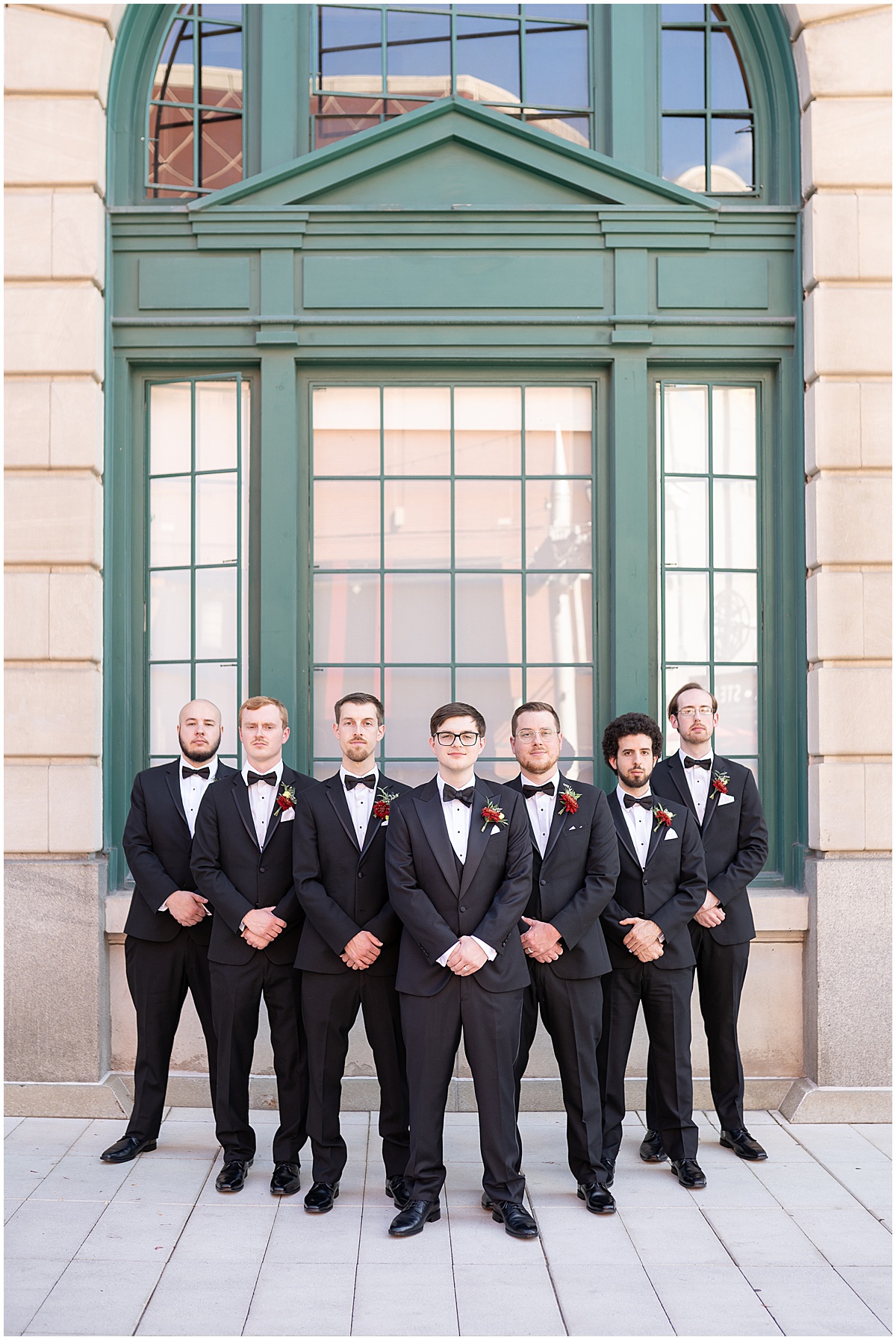 Groomsmen photos in black tuxes in downtown Indianapolis