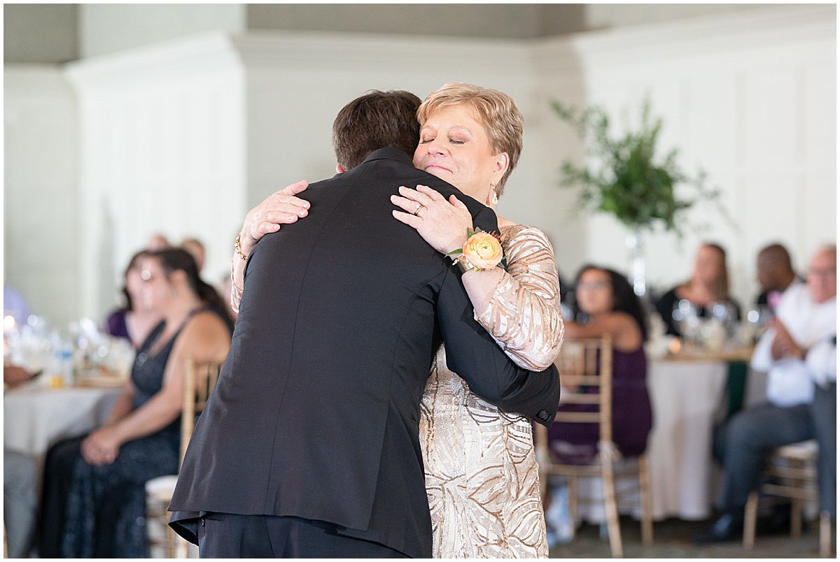 Groom hugs mother after dance at Union Station Illinois Street Ballroom wedding in downtown Indianapolis
