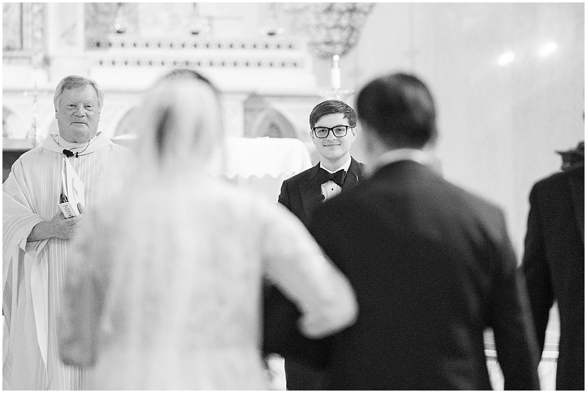 Groom sees bride walking down aisle for wedding at Saint John the Evangelist Church in downtown Indianapolis